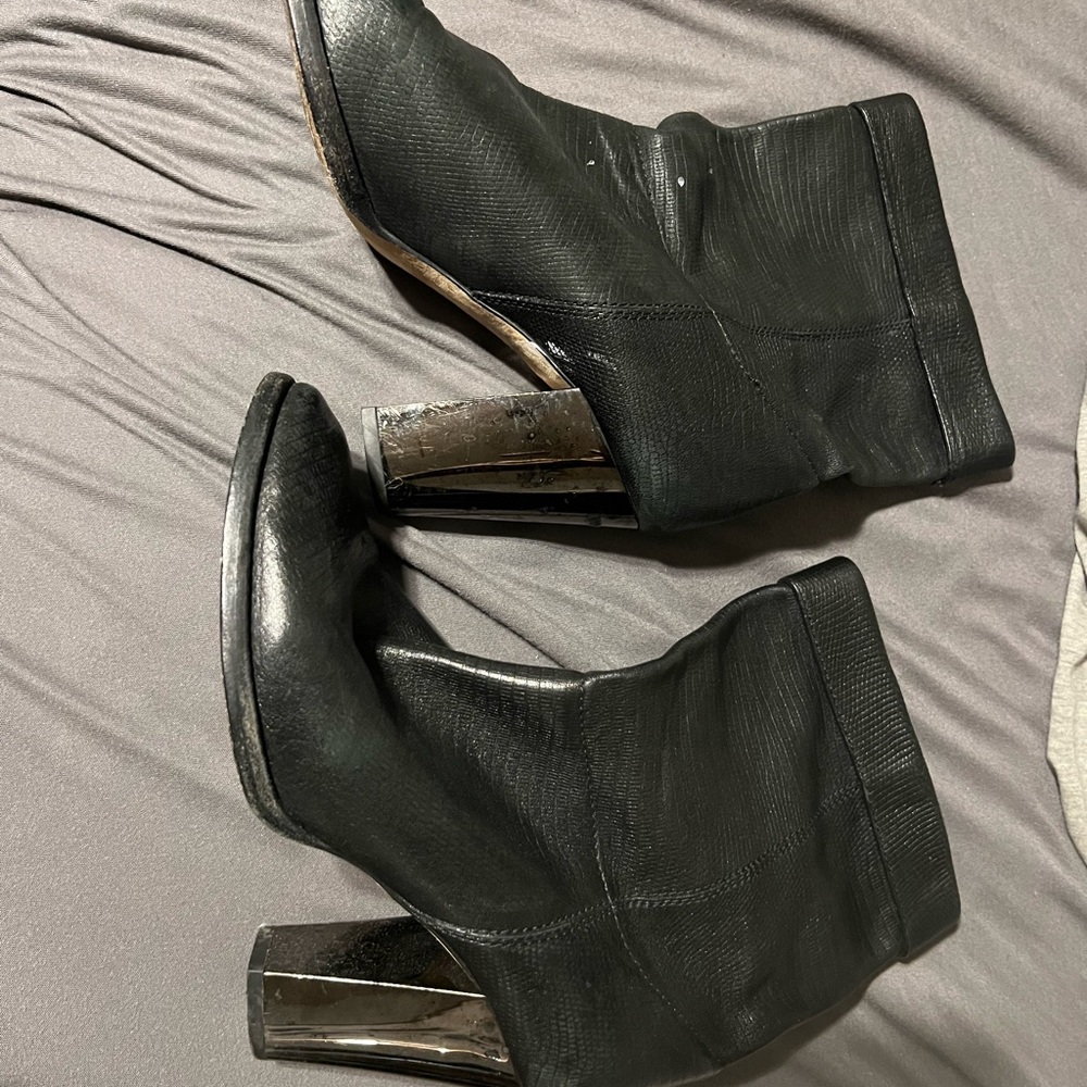 Used Jimmy Choo black textured leather pull on booties, size 7.5